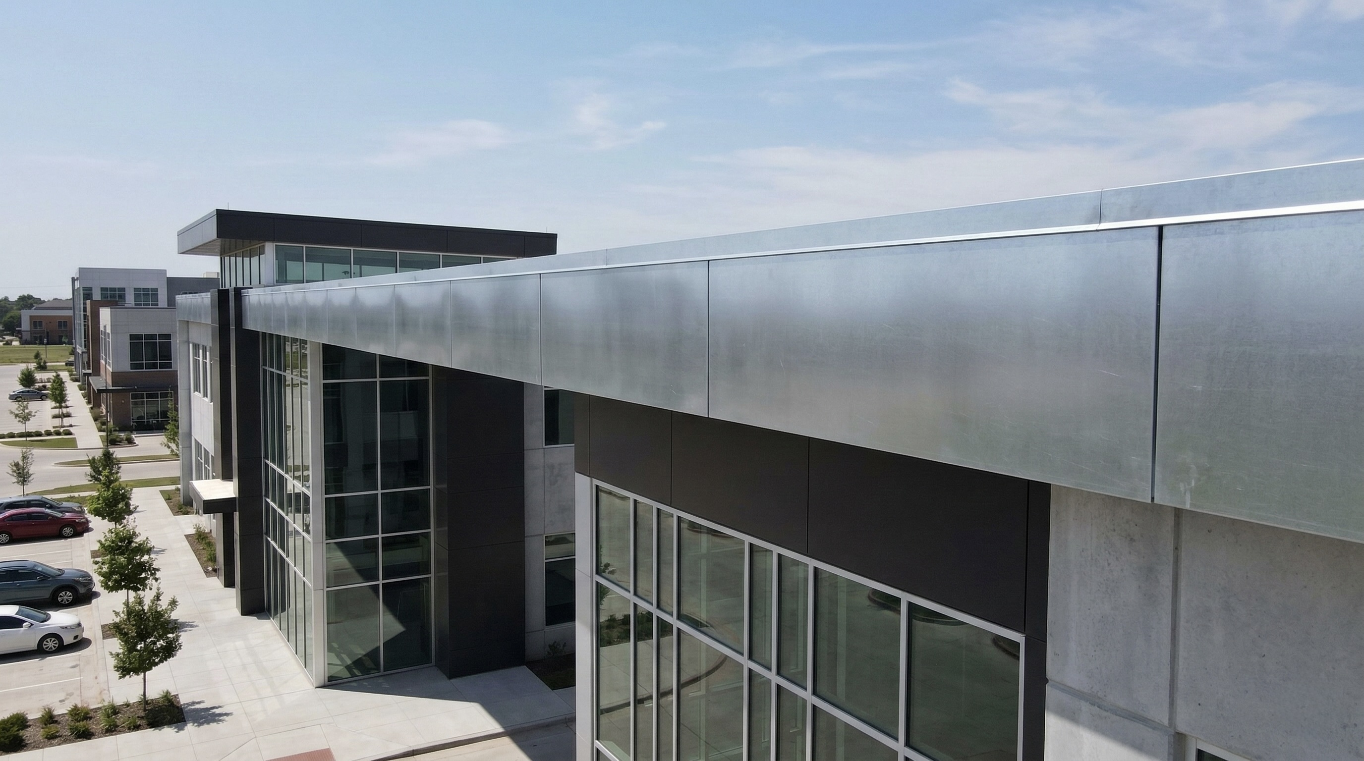 Precision-formed galvanized steel fascia panel for commercial building trim